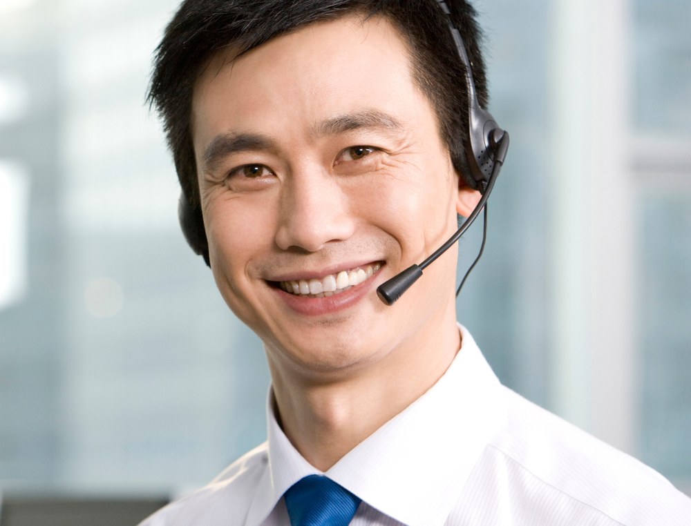 Support agent on a headset in a city office