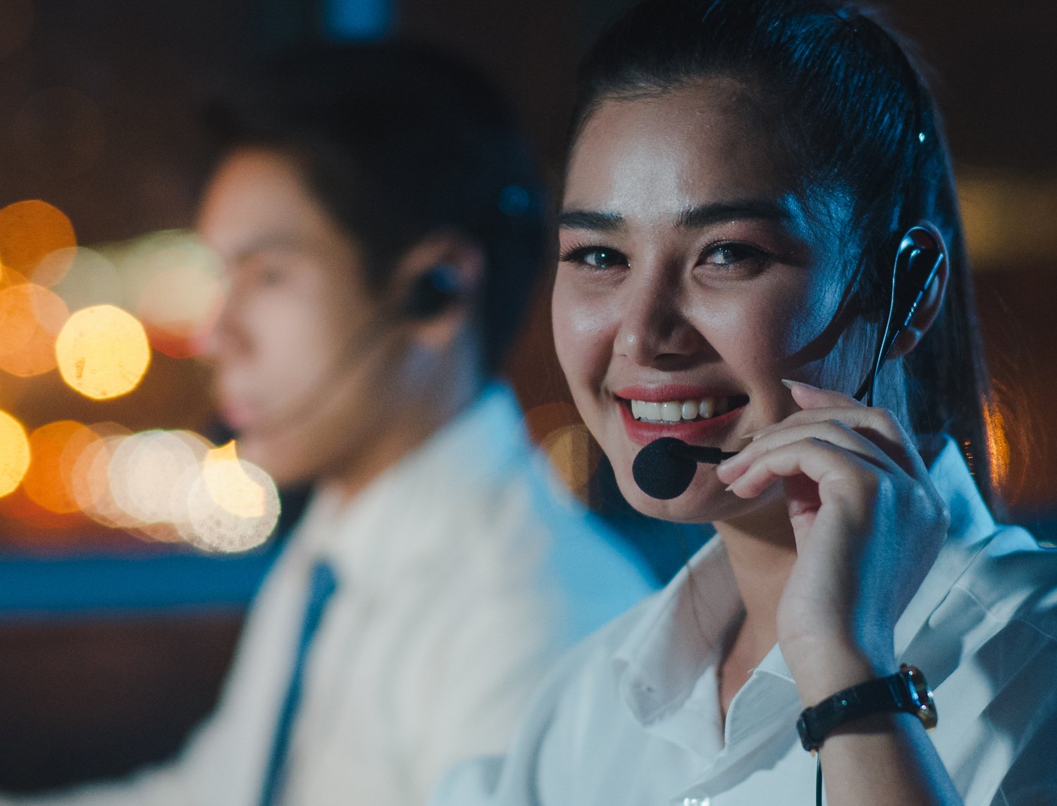 Support agent on a call during an evening shift