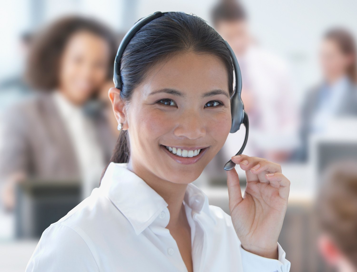 Agent on a call in a busy office